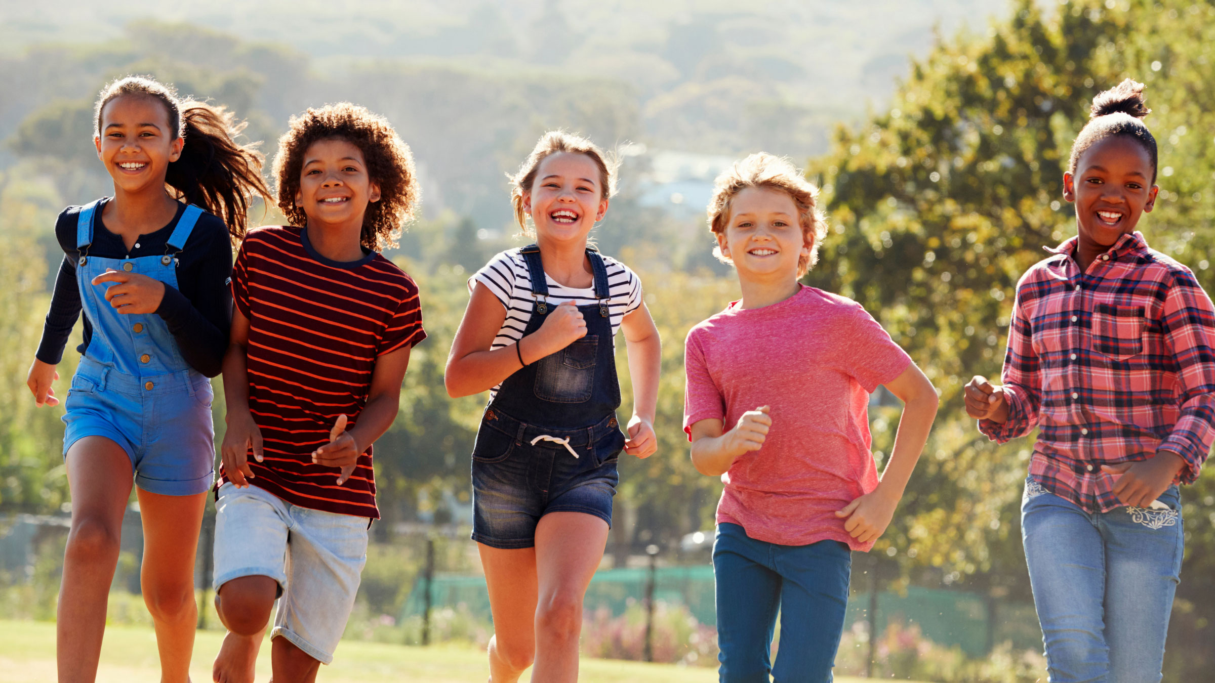 kids running on grass