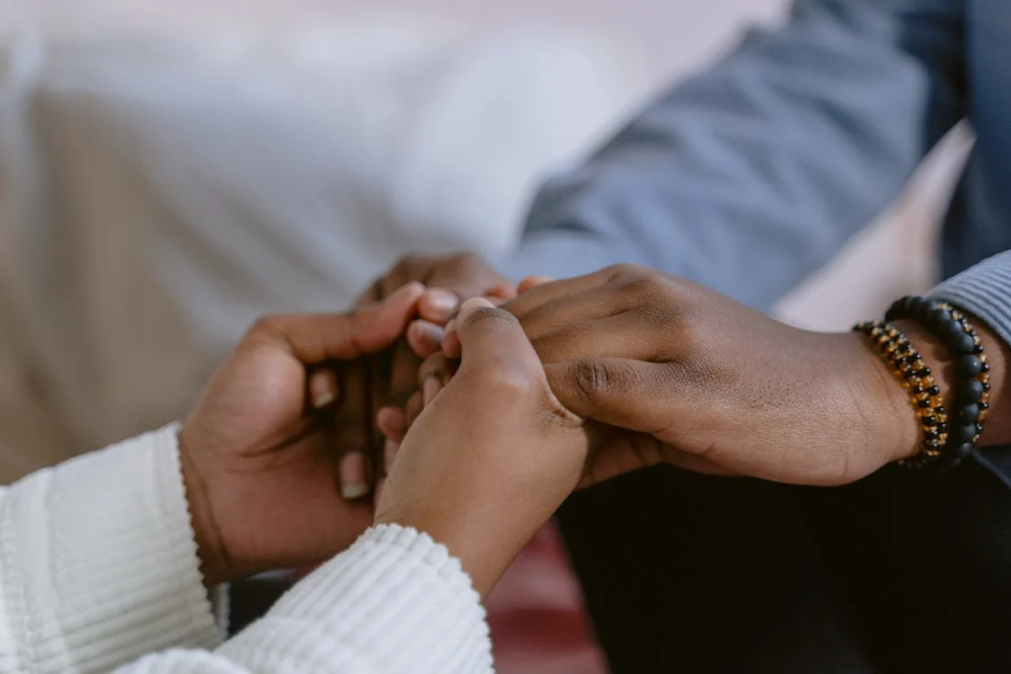 two people holding hands