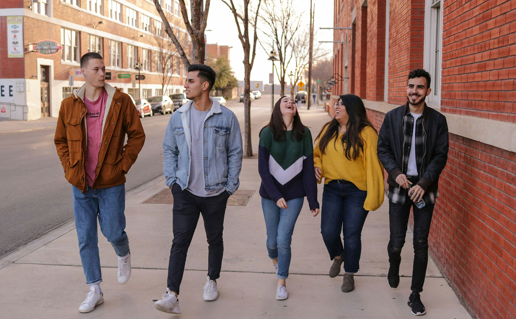 group of people walking and laughing