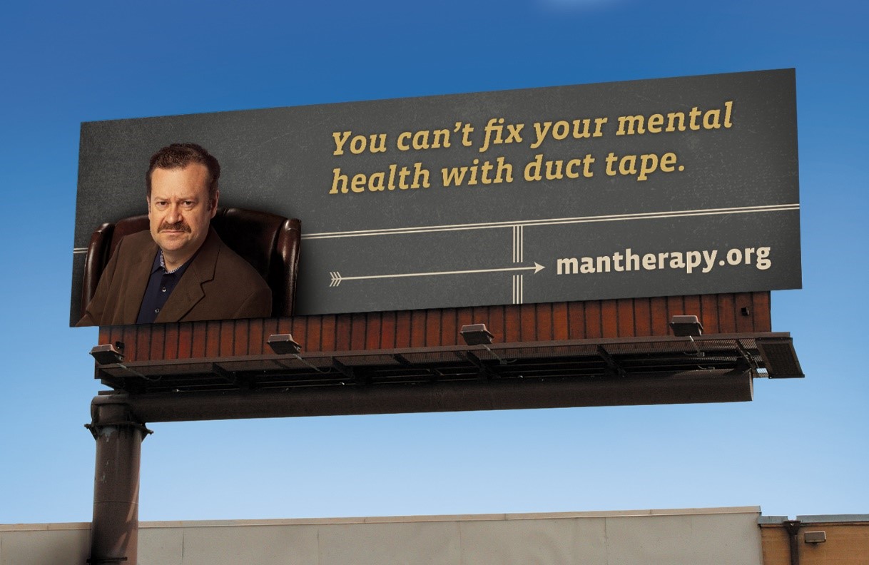 billboard with stern man sitting in a chair and text reading - You can't fix your mental health with duct tape - mantherapy.org