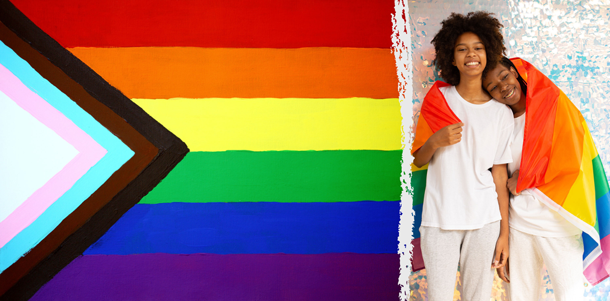 Progressive Pride flag next to two individuals hugging and wearing a Pride flag over their shoulders
