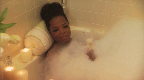 Oprah sits in bathtub