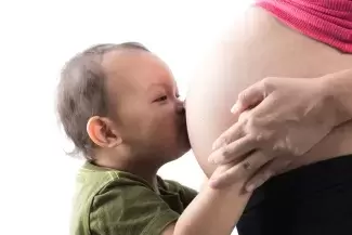 Baby Kissing Pregnant Belly