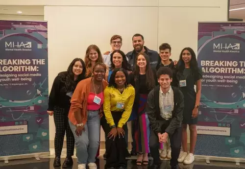 Group of youth and youth advocates stand together at Breaking the Algorithm conference