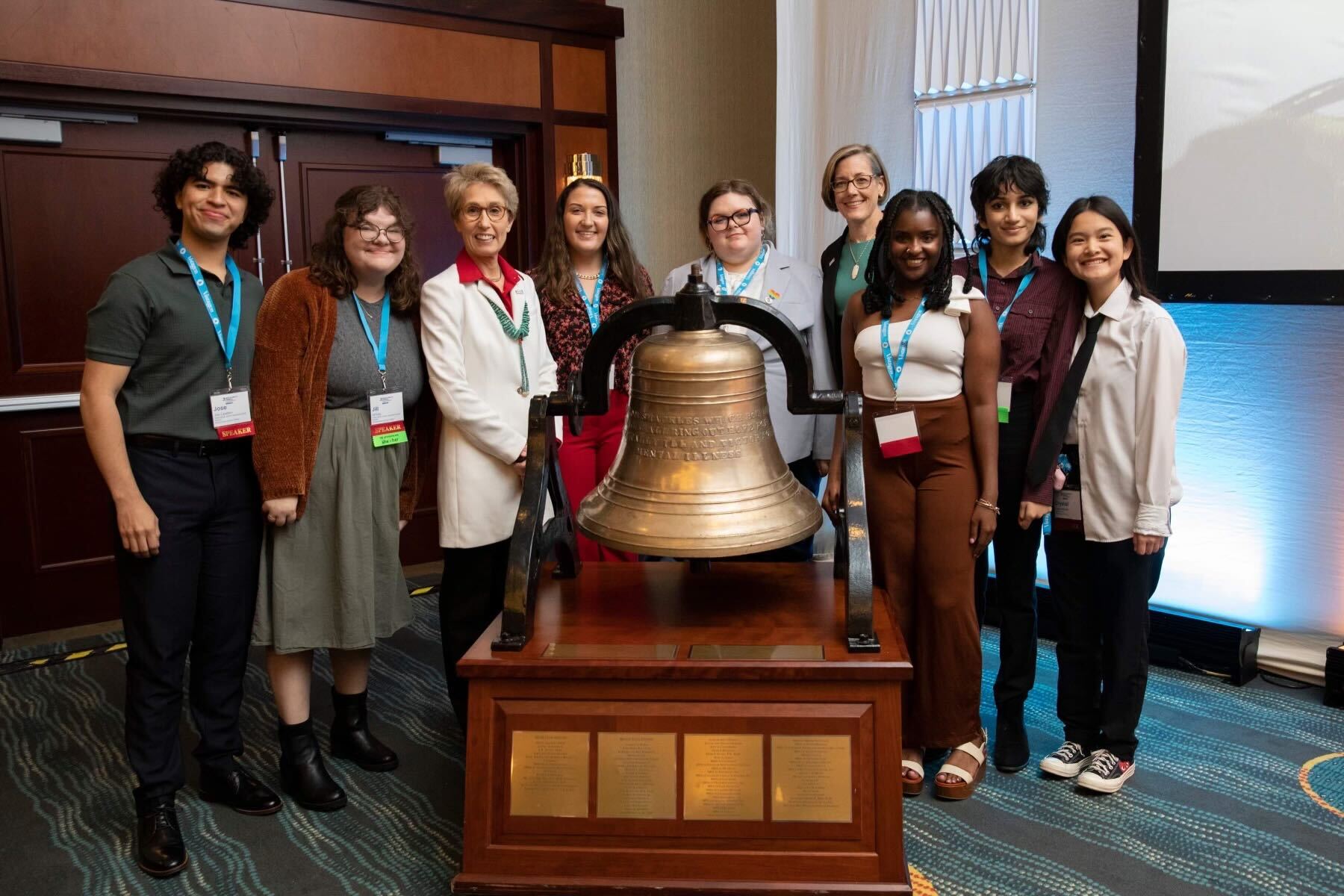 Members of the 2022-23 YMHLC stand with the Mental Health Bell