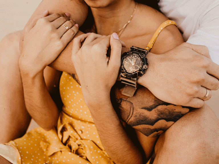 person wraps arm around the front of another person