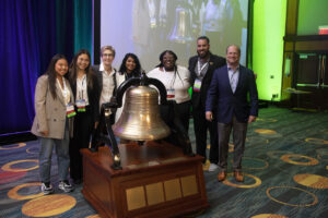 group of young leaders and MHA leadership stand with Mental Health Bell