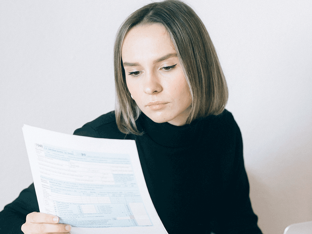 person looks at paperwork